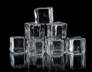 ice cubes on reflection table on black background