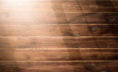 Wall Mural - Wooden background with shadows from a window frame,morning light