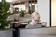 © Andy Paul - Young caucasian office worker at her desk