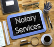 Notary Services - Text on Small Chalkboard. 3d.