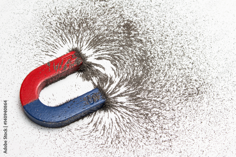 Red and blue horseshoe magnet or physics magnetic with iron powder magnetic field on white background. Scientific experiment in science class in school. - obrazy, fototapety, plakaty 