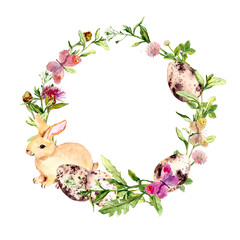 Wall Mural - Easter wreath with easter bunny, colored eggs in grass, flowers. Circle border. Watercolor