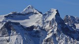 Fototapeta Lawenda - Snow covered peak of mount Uri Rotstock, Swiss Alps.
