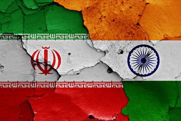 Wall Mural - flags of Iran and India painted on cracked wall