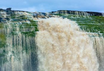 Wall Mural - Right jet of the Hacha waterfall in the lagoon of Canaima national park - Venezuela, Latin America