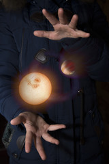 Wall Mural - The vast universe in the hands of a child. Elements of this image furnished by NASA.
