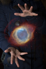 Wall Mural - The vast universe in the hands of a child. Elements of this image furnished by NASA.