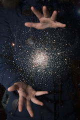 Wall Mural - The vast universe in the hands of a child. Elements of this image furnished by NASA.
