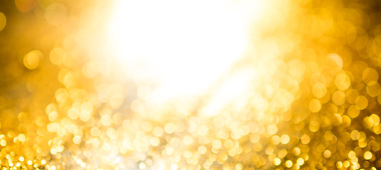 Wall Mural - gold bokeh abstract background defocused lights wide fan page panorama format.