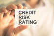 © stanciuc - Businessman holding card with CRR CREDIT RISK RATING acronym text