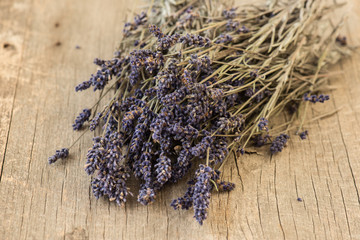 Wall Mural - Bundle of lavender on rustic wooden background 