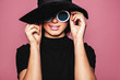 Female model with hat and stylish sunglasses
