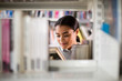 © ReeldealHD images - Student reading a book in library
