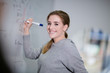 © ReeldealHD images - Student at a whiteboard with pen