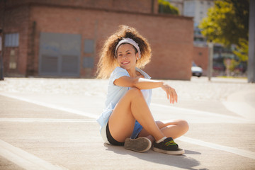 happy latin girl on the street