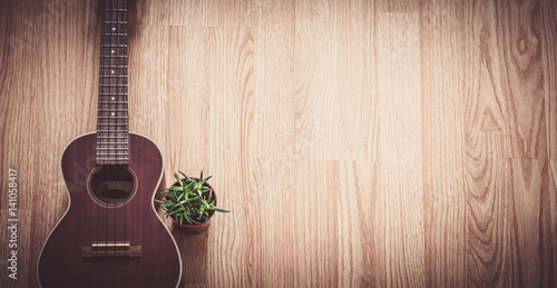 Valokuva Still Life Ukulele on Wooden Floor Background with Copy Space