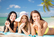 © Syda Productions - happy young women in bikinis on summer beach