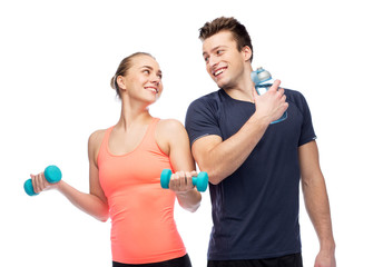 Poster - sportive man and woman with dumbbell and water