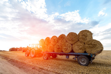 Poster - Sunset above the tractor with a trailer