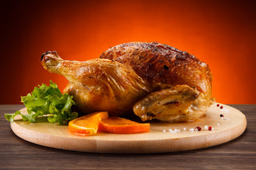 Roast chicken on cutting board