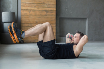 Wall Mural - Young man fitness workout, sit-up crunches for abs