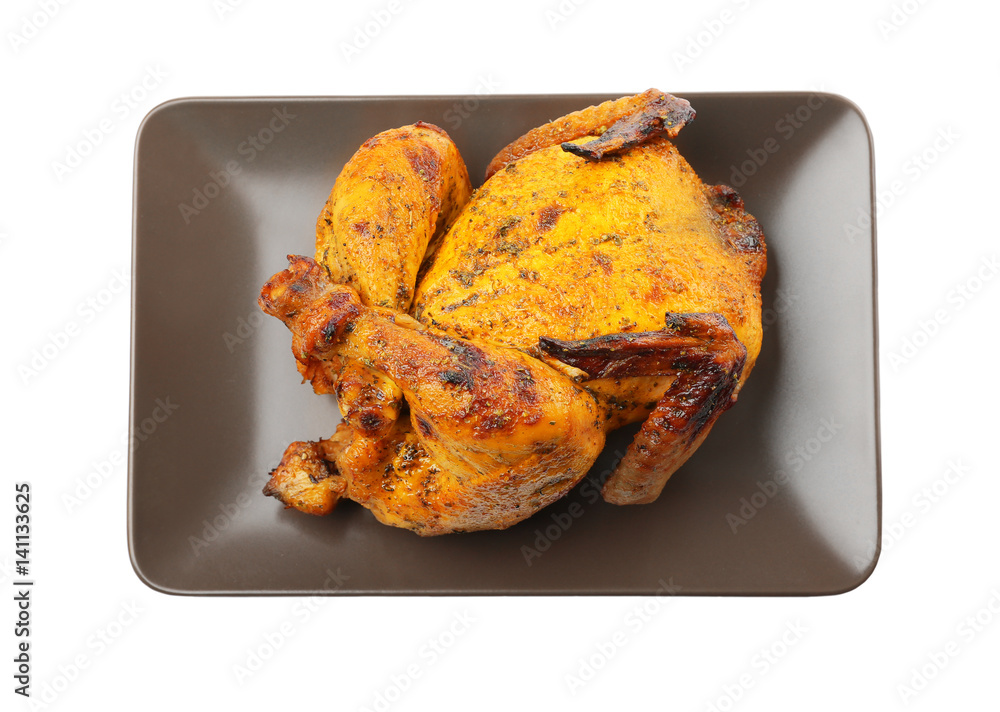 Plate with roasted beer can chicken on white background