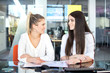© Bojan - Two businesswomen having meeting in modern office.