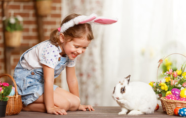 happy easter! happy funny child girl playing with bunny