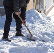 © schankz - Worker cleans snow shovel