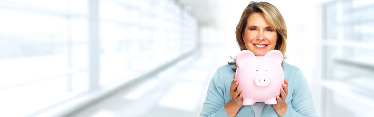 Sticker - Mature woman with piggy bank.