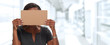 © grinny - Business woman hiding face with cardboard.