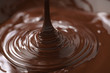 © GCapture - macro photo of premium dark chocolate pour in bowl, shallow focus