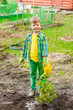 © Ermolaev Alexandr - Boy watering the planted tree