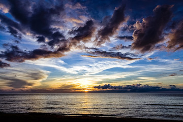 Wall Mural - sunset over calm lake beach