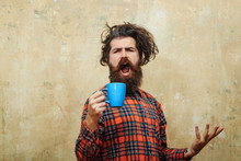 Singing Bearded Man Pulling Stylish Fringe Hair With Blue Cup