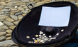 Coins in the tray with the white sheet for writing