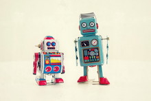 Filtered Vintage Tin Toy Robots Isolated On White Background