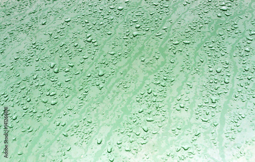 Obraz w ramie Water drops on metal surface with blur effect.