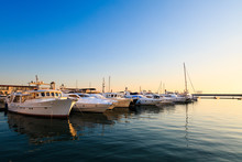 Commercial Port Of Yachts And Motor Boats In Black Sea At Sunset.