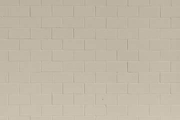 clean, freshly painted, tan, generic, brick cinder block wall background.