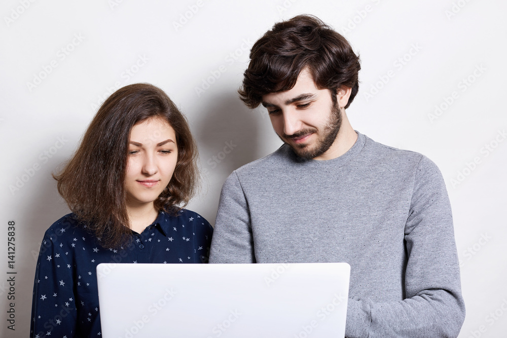 Two best friends surfing Internet using wireless high-speed connection ...