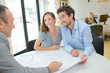 © auremar - Architect drawing up plans with young couple