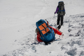 Fototapete - Trekker stuck in the hole in snow while crossing Cho La pass in Everest region, Nepal