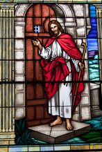 Gorgeous Stained Glass Window Of Jesus Christ Knocking On Door.