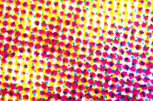 Four Color Printing On White Paper Under The Microscope. CMYK Cyan Magenta Yellow And Key Or Black Color Process. Subtractive Color Mixing. Synthesis With Primary And Secondary Colors. Photo.