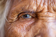 © Southtownboy Studio - Age, Vision and old people concept - Close up of senior asian woman face and eye