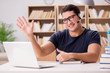 © Elnur - Young freelance worked working on computer