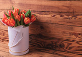 Fototapeta Kwiaty - beautiful fresh spring tulips in a box with copy space