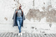© Alena Ozerova - Model posing in plain tshirt against street wall
