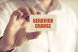 © stanciuc - Businessman holding BEHAVIOR CHANGE message card